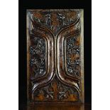 A Late 15th Century Oak Double-sided Panel carved with enriched parchemin decoration and measuring