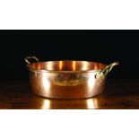 A Large 19th Century Copper Twin-handled Preserving Pan with rolled rim and rivetted side handles