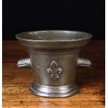 A 17th Century French Bronze Mortar with reeded protuberant handles either side, 5 ins (12.