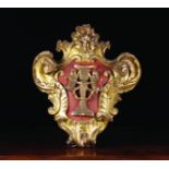 An 18th Century Carved Giltwood Armorial Cartouche emblazoned with a pair of rampant lions flanking