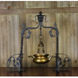 A Gothic Style Bronze Lavabo stamped AMORTEAU CUPILLARD and hanging from a decorative wrought iron