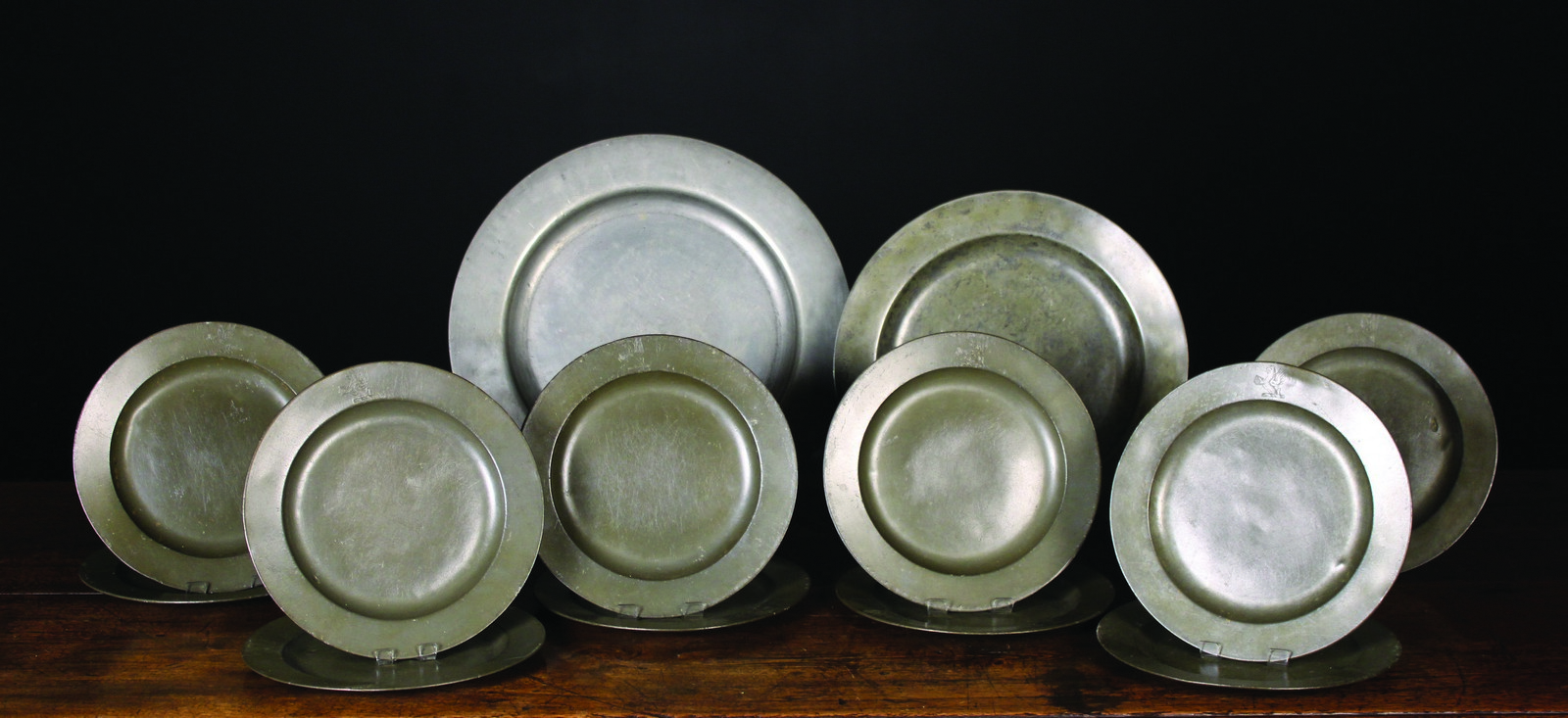 A Collection of 18th Century London Pewter Plates: Eleven dinner plates with Thomas Wheeler's touch