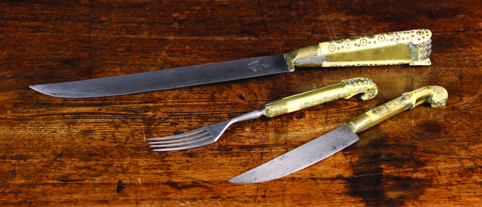 A Late 17th/Early 18th Century Austro-Hungarian Carving Knife along with a smaller knife & fork.