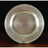 An Antique Triple Reeded Pewter Charger by Edward Leapidge, 16 5/8 ins (42 cms) in diameter.