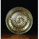 A 16th Century Nuremberg Brass Repoussé Alms Dish.