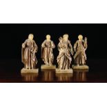 A Set of Four 17th Century Style Carved Wooden Saints; two male, two female,