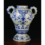 A Large 18th Century Blue & White Faience Apothecary Jar with twisted twin handles,