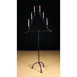 A 17th Century Wrought Iron Candle Standard.