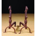 A Pair of Antique Wrought Iron Fire Dogs with hooked serpent head finials,