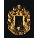 A 17th Century Carved, Polychromed & Gilded Frame containing a rectangular bevelled mirror,
