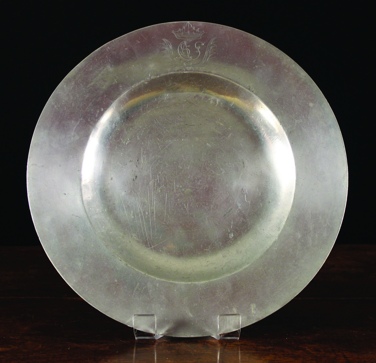 A 17th Century Broad Rimmed Pewter Dish by Nicholas Kelk, Circa 1660, 15 ins (38 cms) in diameter.