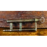 A 17th Century Cylindrical Iron Lock & Key, 12½ ins (32 cms) in length.