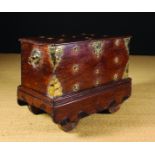 A 19th Century Dutch Colonial Chest on Wheels with decorative brass appliqués.
