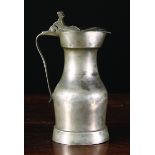 An Early 18th Century Paris style Pewter Pichet by Pierre de Lavigne, 10½ ins (27 cms) in height.