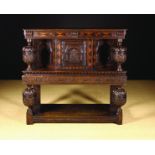 A 17th Century Carved Oak Court Cupboard.