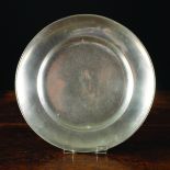 A Plain Rimmed Pewter Plate with wide hollow rim, by Freidrich Traugott Franke of Bautzen, Saxony,