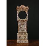 A 19th Century Miniature Grandfather Clock Case elaborately carved in the Renaissance style and