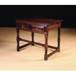 A Late 17th Century Oak Side Table having a moulded frieze drawer with brass pendant handles,