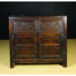 A 17th Century Joined Oak Standing Box-topped Cupboard with lift-up lid.