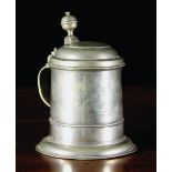 An 18th Century Pewter Bootmakers' Guild Tankard dated 1717, 8 ins (20.5 cms) in height.