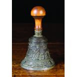 A 16th Century Flemish Bronze Table Bell cast in relief with Orpheus and animals,