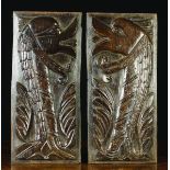 A Pair of Fine 16th Century Oak Panels carved with zoomorphic fish with frilled fins of imbricated