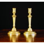 A Pair of Brass Candlesticks Circa 1800, 8½ ins (21.5 cms) in height.