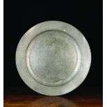 A Large Antique Pewter Charger (no marks), 20 ins (51 cms) in diameter.