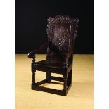 A 17th Century Inlaid Oak Wainscot Chair.