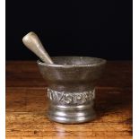 A 17th Century Bronze Pestle & Mortar. The double ended pestle 7 ins (17.5 cms) in length.