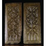 A Pair of 16th Century Oak Panels carved with compass work tracery centred by flowers above double