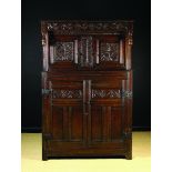 A 17th Century Oak Court Cupboard.