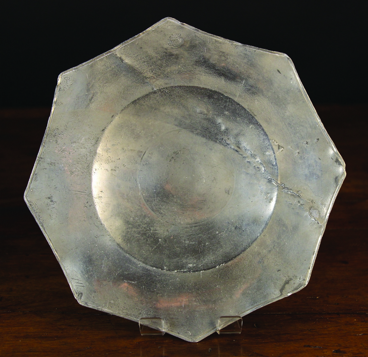 A 16th Century Pewter Eight-Pointed Plate with bossed base,