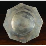 A 16th Century Pewter Eight-Pointed Plate with bossed base,