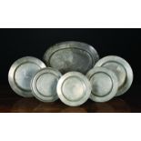 Five Antique Pewter Plates; the largest 12 ins (31 cms) in diameter,