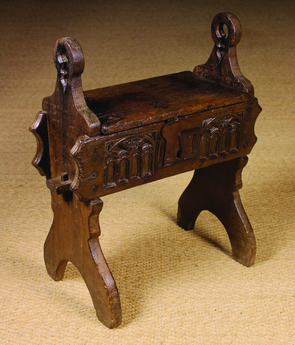 A Rare Carved Oak Gothic Tracery Box Stool with hinged lid.