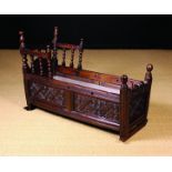 A Fine William & Mary Carved Oak Crib dated 1695.