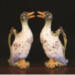 A Pair of Ceramic Novelty Ewers modelled in the form of ducks having moulded bull rush handles and