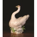 A 20th Century Dresden Porcelain Model of a Swan, 11½ ins (29 cms) in height.