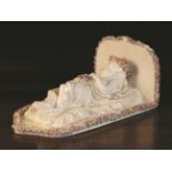 A Vienna Porcelain White Glazed Model of a Dormant Child draped in a gilt edged cloth,