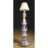 A Novelty Standard Lamp made from a stack of decorative blue & white pottery secured by a central
