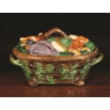 A Victorian Majolica Game Dish, relief moulded with basket weave entwined in branches of oak,