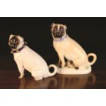 Two Fine Porcelain Pug Dog Figures: One modelled as a seated pug wearing a gilt edged Bleu-Celeste