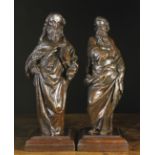 A Pair of 17th Century Carvings of Apostles mounted on later moulded plinth bases.