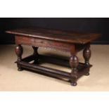 A 17th Century Dutch Oak Side Table The single piece top with cleated ends.