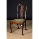 A Queen Anne Style Elm Side Chair having a shaped central back splat and padded drop inset covered