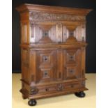 A Mid 17th Century Flemish Carved Oak Four-door Cupboard or ‘Beeldenkast’ with an upper and lower