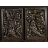 A Pair of Late 17th Century Carved Oak Panels decorated with birds amongst foliage feeding on seed