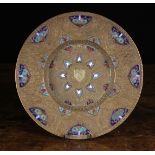 An Italian Renaissance Brass & Enamelled Plate decorated with intricately engraved urns of foliage