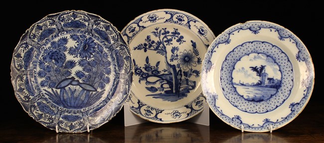 Three Large 18th Century Blue & White Delft Plates: The largest decorated with a fruit tree and